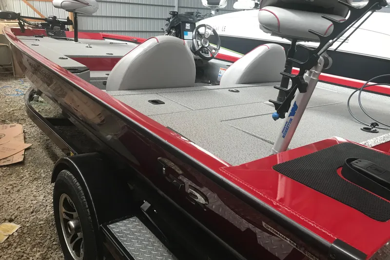 Slide: The Image of 2018 G3 Sportsman 19 boat with red exterior and spacious interior layout. - 8