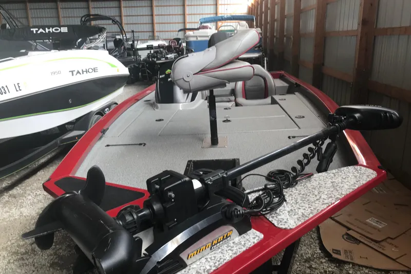 Slide: The Image of 2018 G3 Sportsman 19 boat in storage, featuring a trolling motor and spacious deck. - 17
