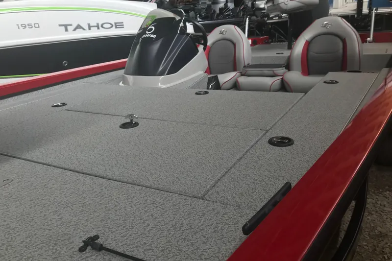 Slide: The Image of 2018 G3 Sportsman 19 boat with gray deck and red accents in showroom. - 19