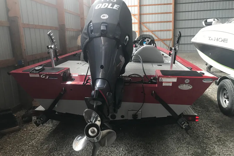 Slide: The Image of 2018 G3 Sportsman 19 boat with outboard motor in storage shed. - 7