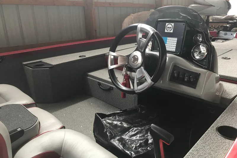 Slide: The Image of 2018 G3 Sportsman 19 boat interior with steering wheel and dashboard controls. - 5