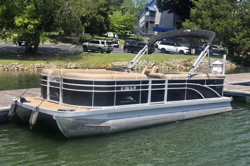 The Image of 2019 Bennington SX 22 SLX pontoon boat docked on a sunny day. - 0