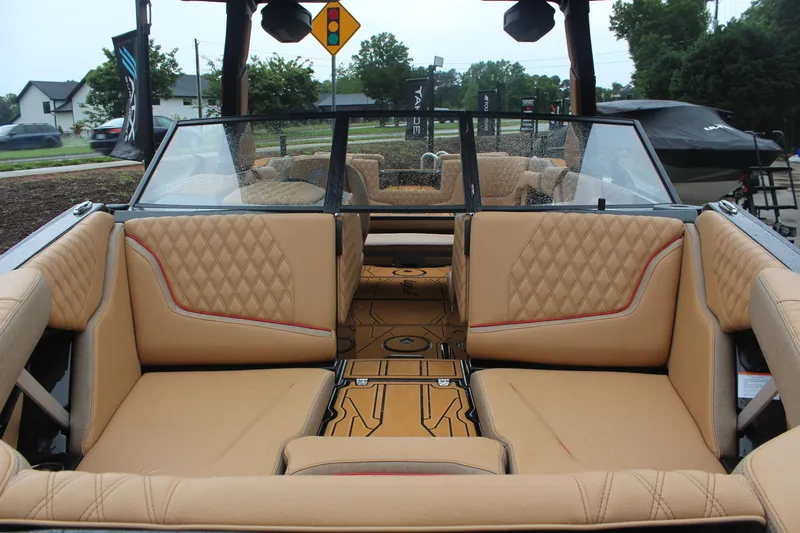 Slide: The Image of Interior view of 2026 Tigé 24RZX boat with tan quilted seating. - 9