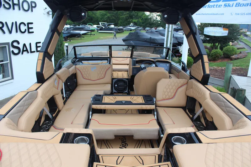 Slide: The Image of Luxurious interior of a 2026 Tigé 24RZX boat with tan seating and modern design. - 10