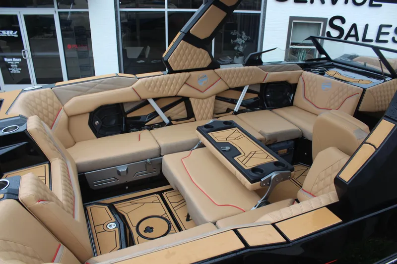 Slide: The Image of Luxurious interior of 2026 Tigé 24RZX boat with tan upholstery and modern design. - 11