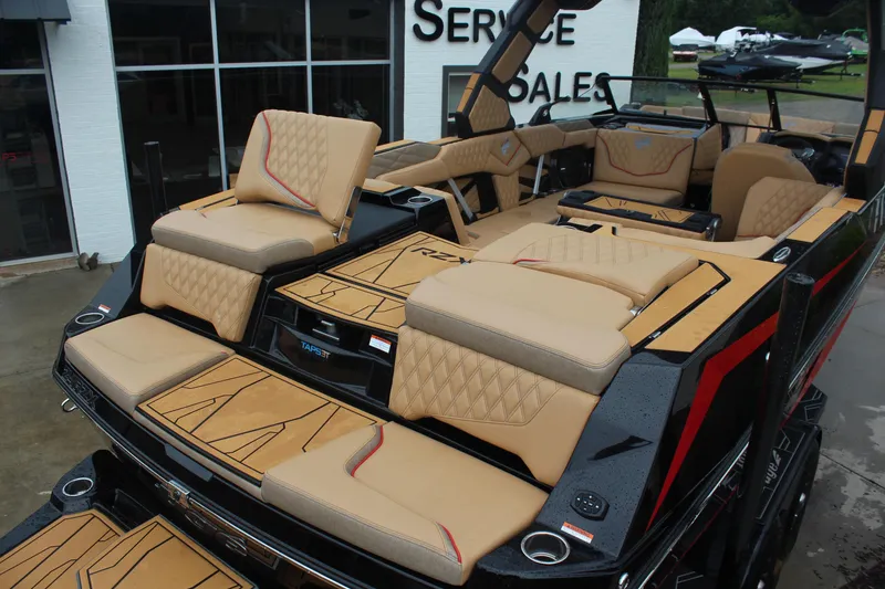 Slide: The Image of 2026 Tigé 24RZX boat with luxurious tan seating and modern design. - 5
