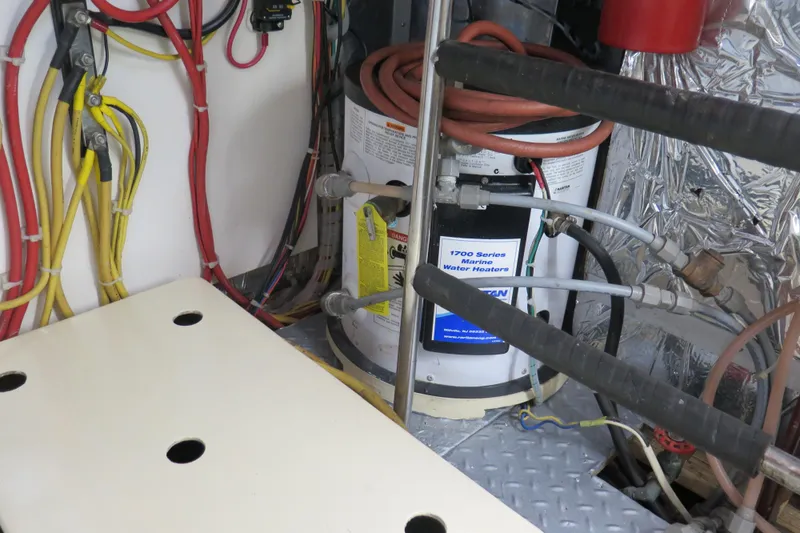 Slide: The Image of Engine room of 1987 Hershine Aftcabin Motoryacht with marine water heater and wiring. - 17