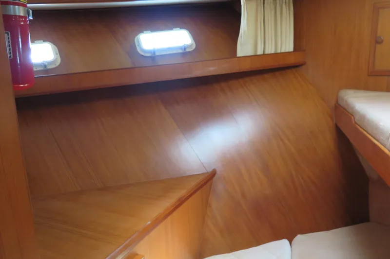 Slide: The Image of Interior of 1987 Hershine Aftcabin Motoryacht with wooden paneling and portholes. - 30