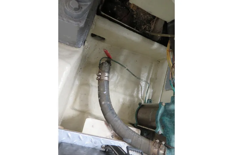 Slide: The Image of Engine compartment of 1987 Hershine Aftcabin Motoryacht with visible hose and wiring. - 14