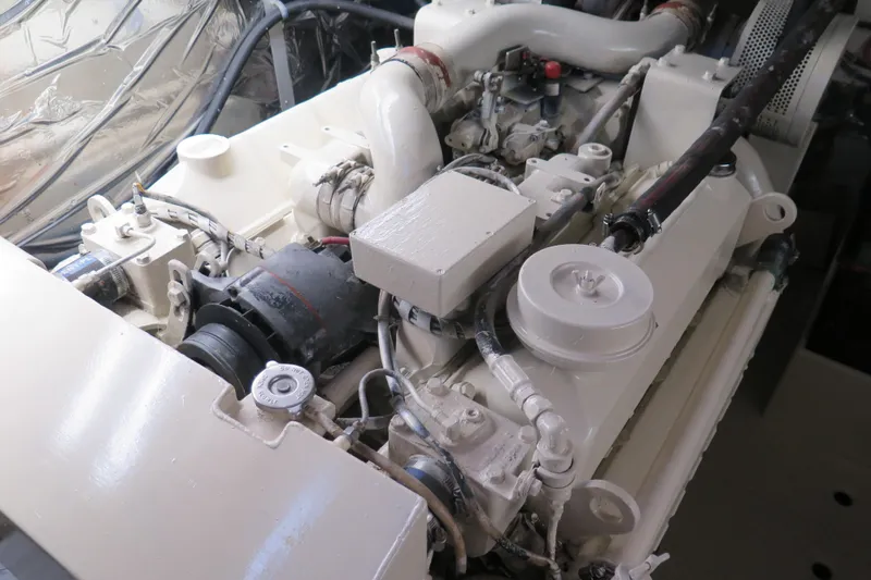Slide: The Image of Engine compartment of a 1987 Hershine Aftcabin Motoryacht with Cockpit, showcasing mechanical components. - 18