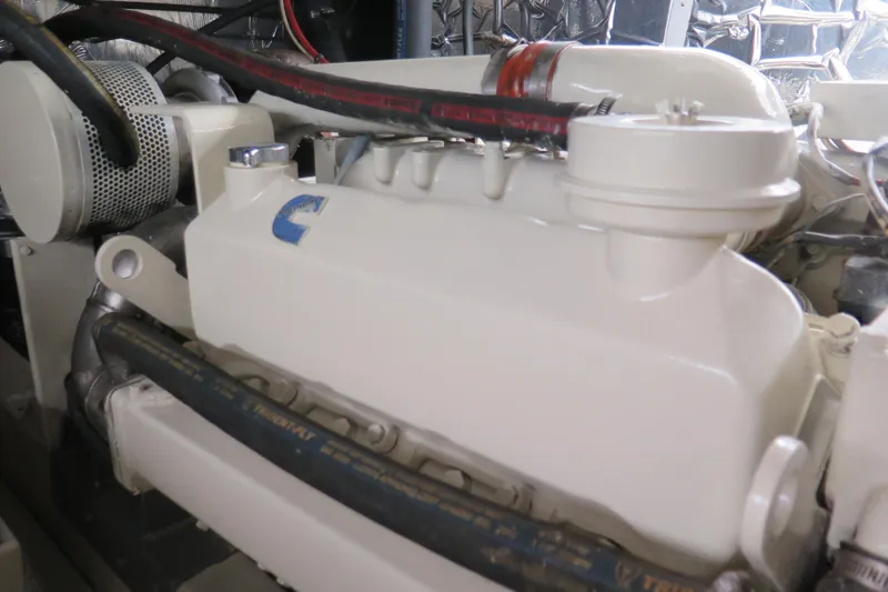 Slide: The Image of Engine compartment of a 1987 Hershine Aftcabin Motoryacht with visible components and hoses. - 13