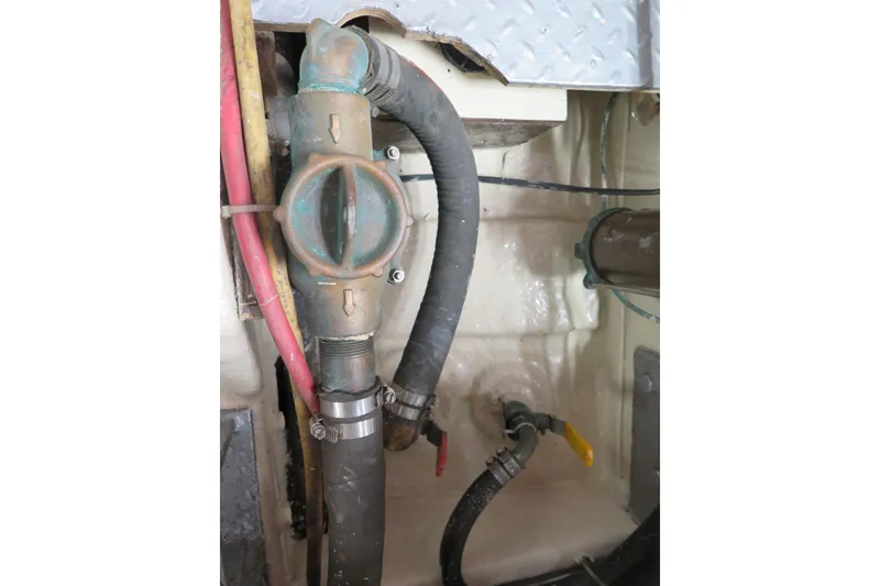 Slide: The Image of Engine compartment of 1987 Hershine Aftcabin Motoryacht, showing hoses and fittings. - 15