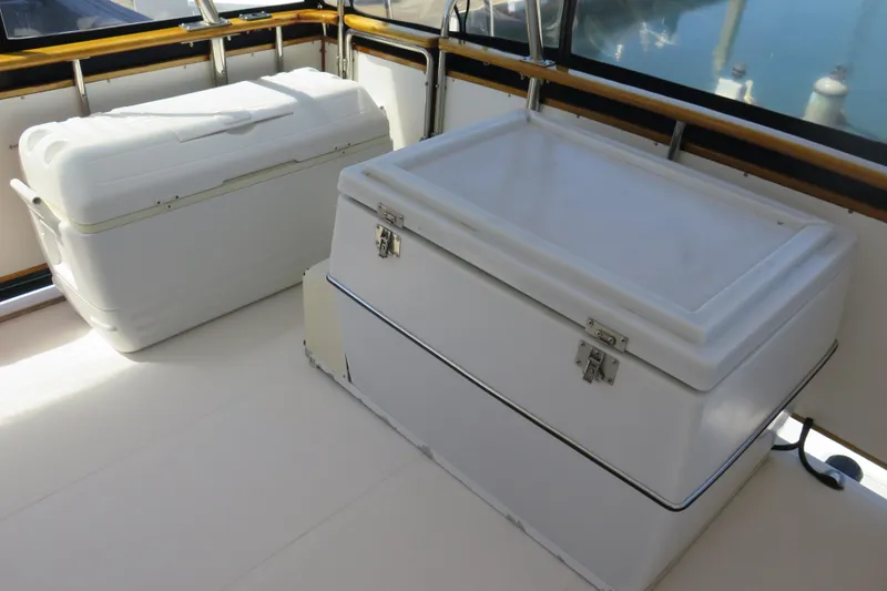 Slide: The Image of 1987 Hershine Aftcabin Motoryacht cockpit with two white storage coolers. - 6