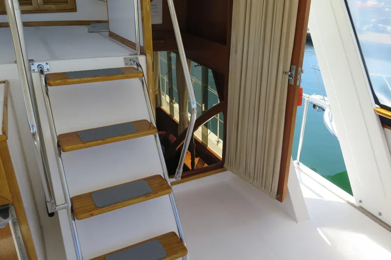 Slide: The Image of Staircase and open door on 1987 Hershine Aftcabin Motoryacht with Cockpit. - 12