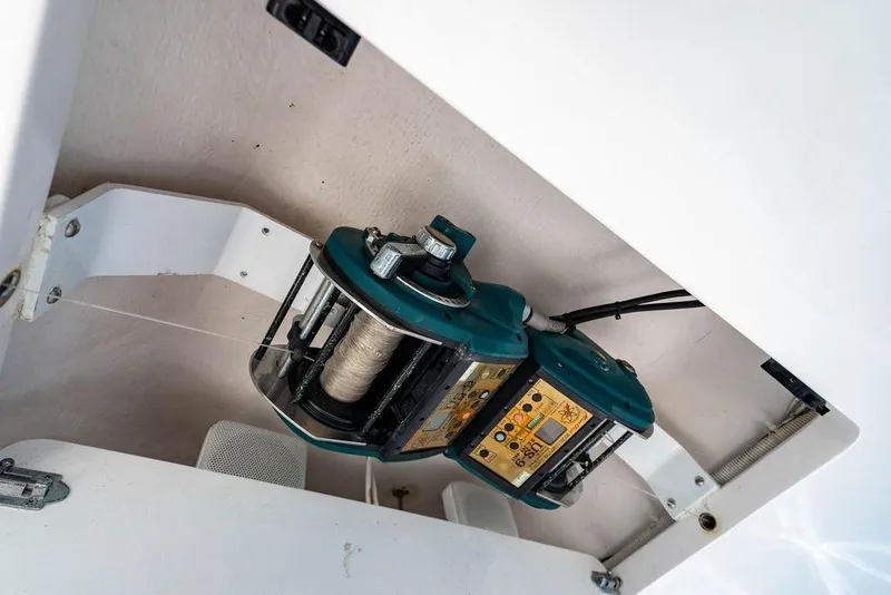 Slide: The Image of Fishing reel mechanism on a 2006 Viking 56 Convertible yacht, showcasing intricate details. - 40