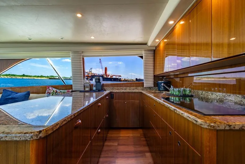 Slide: The Image of Luxurious interior of 2006 Viking 56 Convertible yacht with elegant wood cabinetry and ocean view. - 19