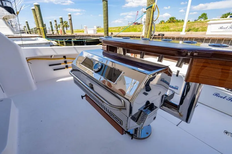 Slide: The Image of Luxury grill setup on 2006 Viking 56 Convertible yacht deck, docked at marina. - 47