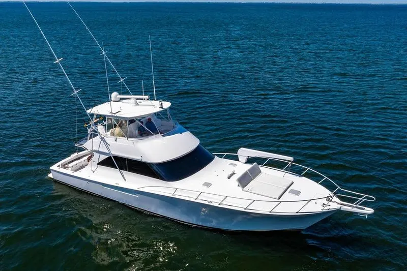Slide: The Image of 2006 Viking 56 Convertible yacht cruising on open water. - 4