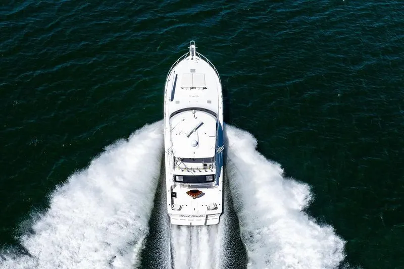 Slide: The Image of Aerial view of 2006 Viking 56 Convertible yacht cruising on open water. - 14