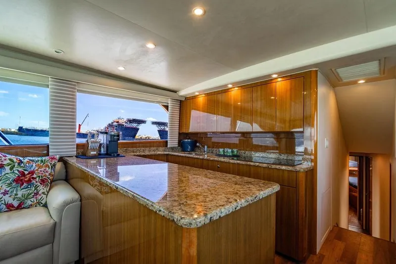 Slide: The Image of Luxurious interior of 2006 Viking 56 Convertible yacht with granite countertops and ocean view. - 21