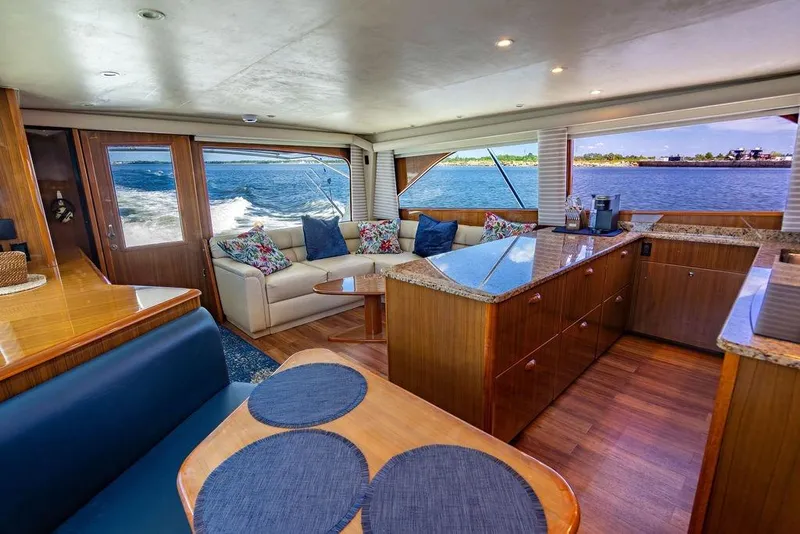 Slide: The Image of Luxurious interior of 2006 Viking 56 Convertible yacht with ocean view and elegant furnishings. - 18