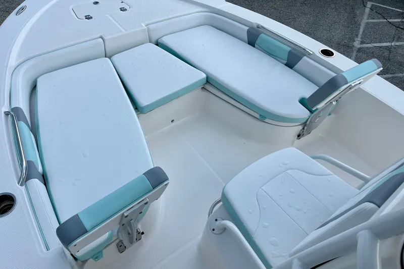 Slide: The Image of 2024 Robalo 206 Cayman boat interior with cushioned seating and sleek design. - 17