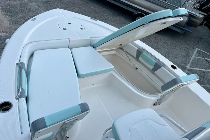 Slide: The Image of 2024 Robalo 206 Cayman boat interior with seating and storage compartments. - 18