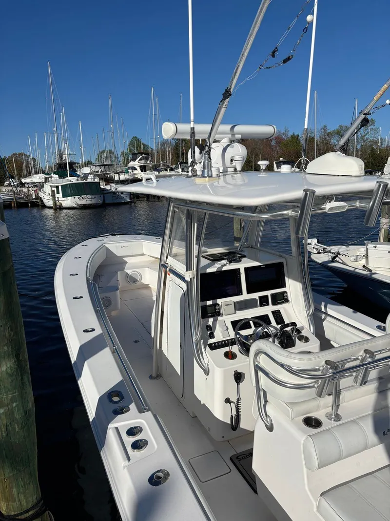 Slide: The Image of Contender 35 ST 2015: A sleek, white boat with modern electronics and a spacious deck. - 2