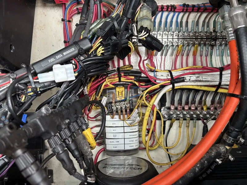 Slide: The Image of Electrical panel with colored wires and fuses inside a boat. - 7