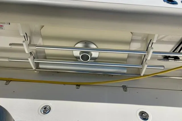 Slide: The Image of 2025 Boston Whaler 330 Outrage boat deck with stainless steel railing and fixtures. - 13