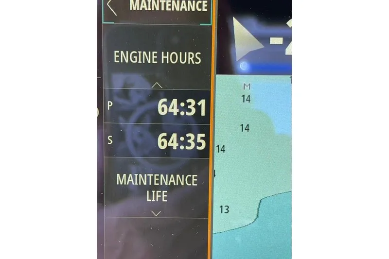 Slide: The Image of Display screen showing engine hours and maintenance for 2025 Boston Whaler 330 Outrage. - 16