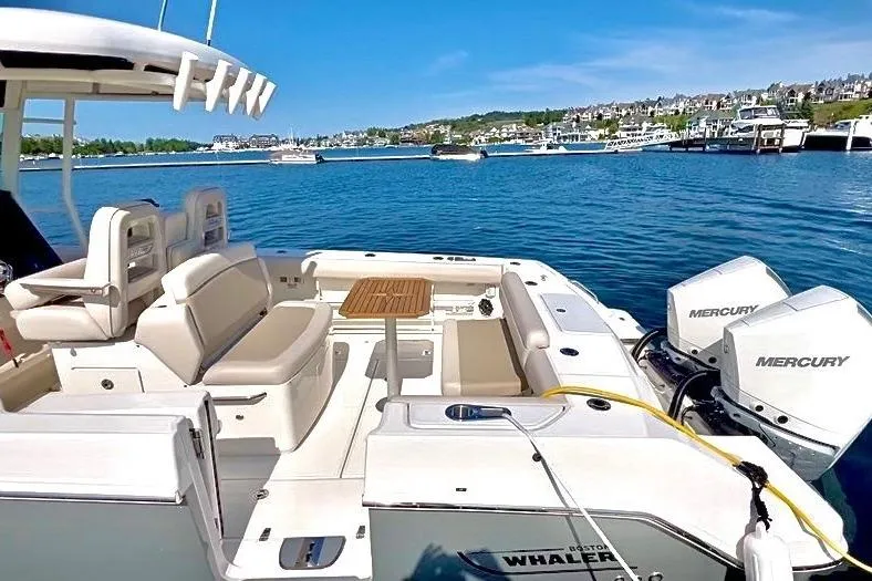 Slide: The Image of 2025 Boston Whaler 330 Outrage boat with Mercury engines on a sunny day. - 20