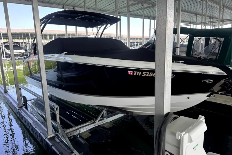 Slide: The Image of 2019 Cobalt R7 boat docked in a covered marina slip. - 3