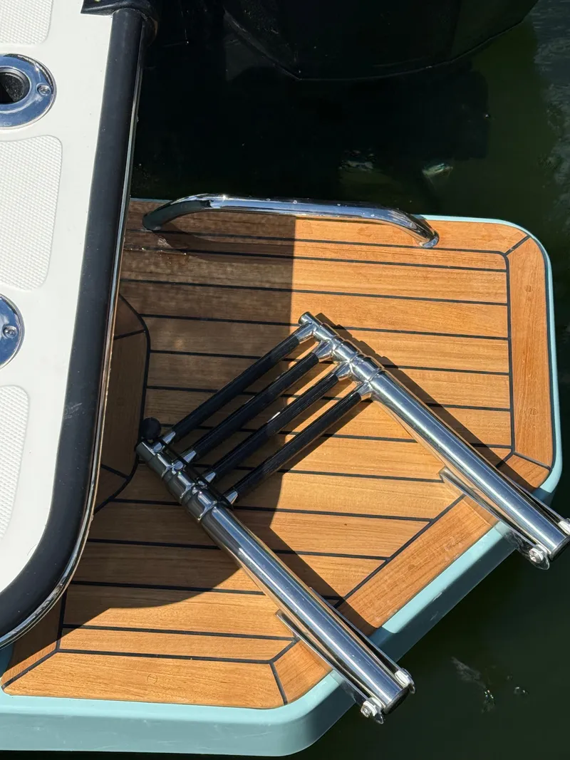 Slide: The Image of A swim platform with a retractable ladder on a boat. - 16