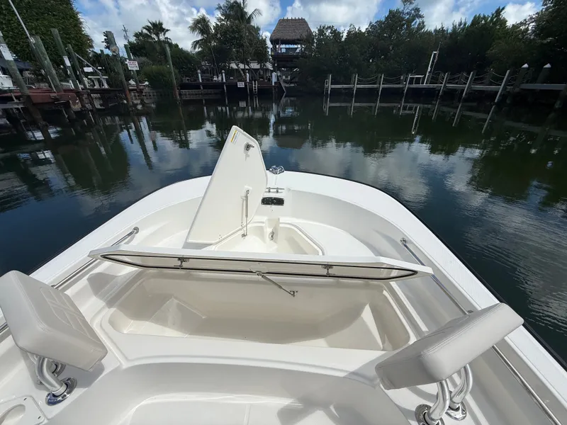 Slide: The Image of The image shows the bow of a Boston Whaler 210 Montauk with seating and storage. - 9