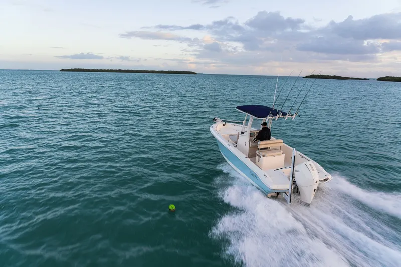 Slide: The Image of A 2027 Boston Whaler 220 Dauntless speeds across the open sea. - 24
