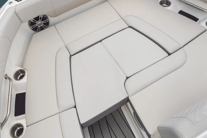 Slide: The Image of The image shows the luxurious, cushioned deck of a Sea Ray SDX 250 boat. - 83