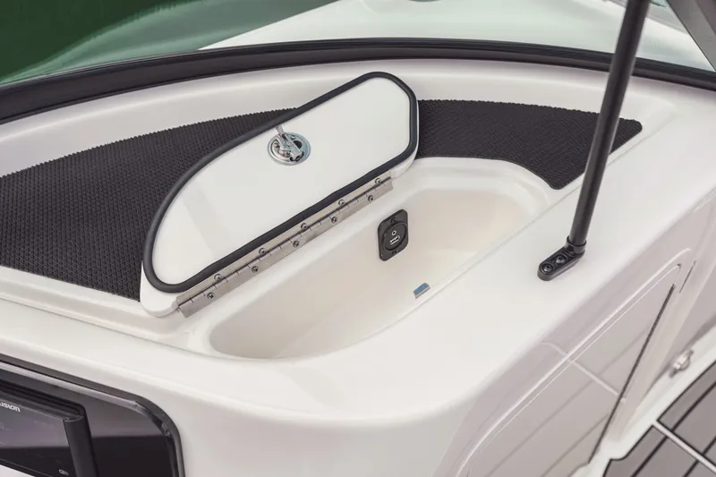 Slide: The Image of The image shows a part of the 2025 Sea Ray SDX 250 with a built-in storage compartment. - 48