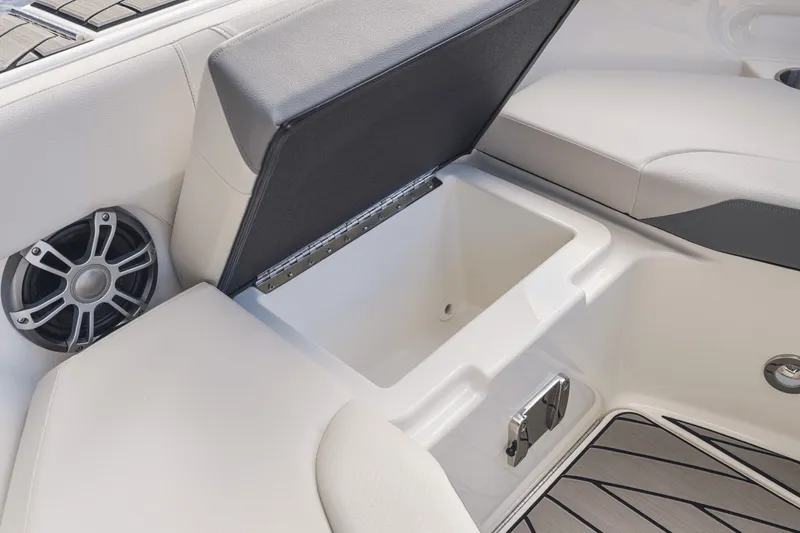 Slide: The Image of The image shows a seating area with an open storage compartment and a speaker. - 22