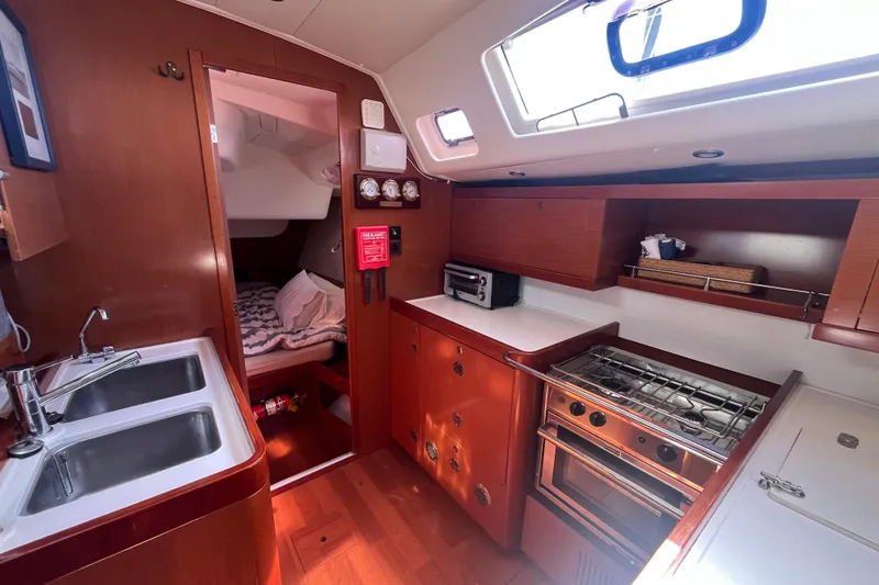 Slide: The Image of Interior of 2011 Beneteau Oceanis 54 yacht with kitchen and cozy cabin. - 27
