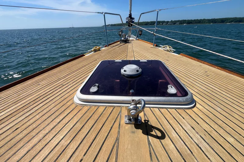Slide: The Image of Deck view of 2011 Beneteau Oceanis 54 sailboat on open water. - 7