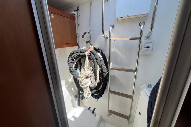 Slide: The Image of Interior of 2011 Beneteau Oceanis 54 yacht with ladder and coiled ropes. - 50