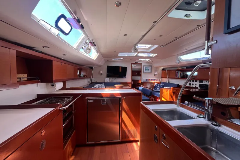 Slide: The Image of Luxurious interior of 2011 Beneteau Oceanis 54 yacht with modern kitchen and seating area. - 44