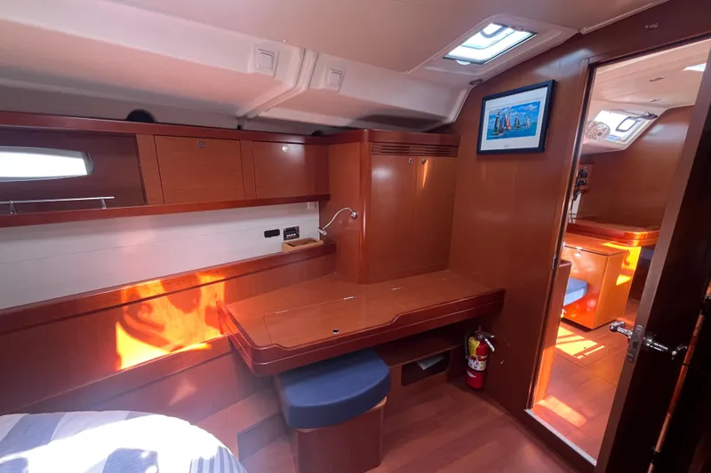 Slide: The Image of Interior of 2011 Beneteau Oceanis 54 yacht with wooden cabinetry and seating. - 36
