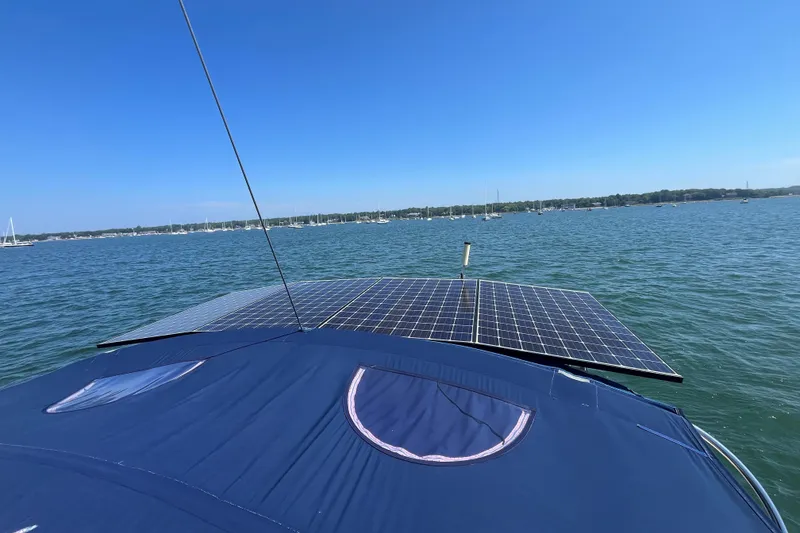 Slide: The Image of Beneteau Oceanis 54 sailboat with solar panels on deck, sailing on a sunny day, 2011 model. - 46
