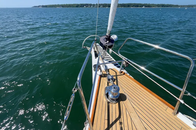 Slide: The Image of Bow of 2011 Beneteau Oceanis 54 sailboat on open water, sunny day. - 8