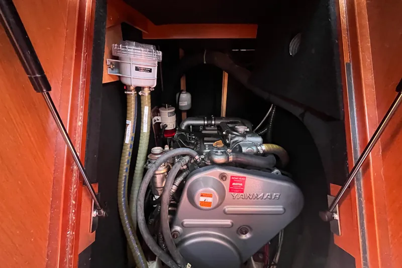 Slide: The Image of Engine compartment of a 2011 Beneteau Oceanis 54 sailboat, featuring a Yanmar engine. - 47
