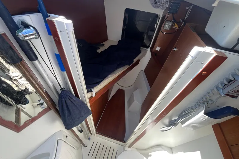 Slide: The Image of Interior cabin of 2011 Beneteau Oceanis 54 sailboat, featuring storage and equipment. - 48