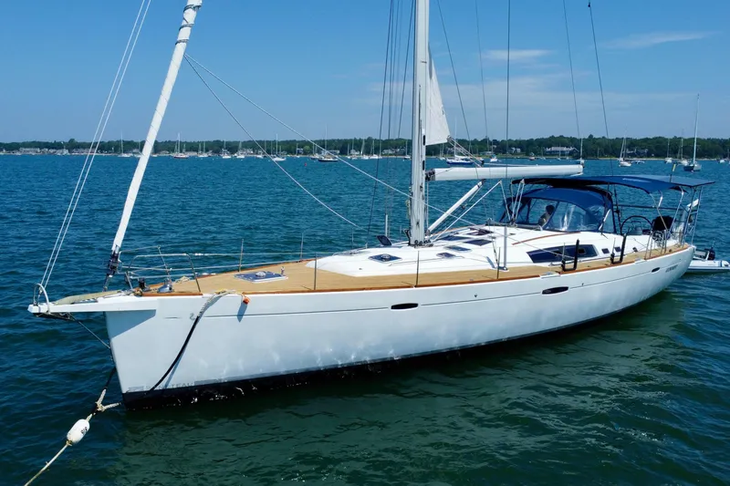 The Image of Sailing yacht Beneteau Oceanis 54, 2011 model, anchored in a serene bay. - 0