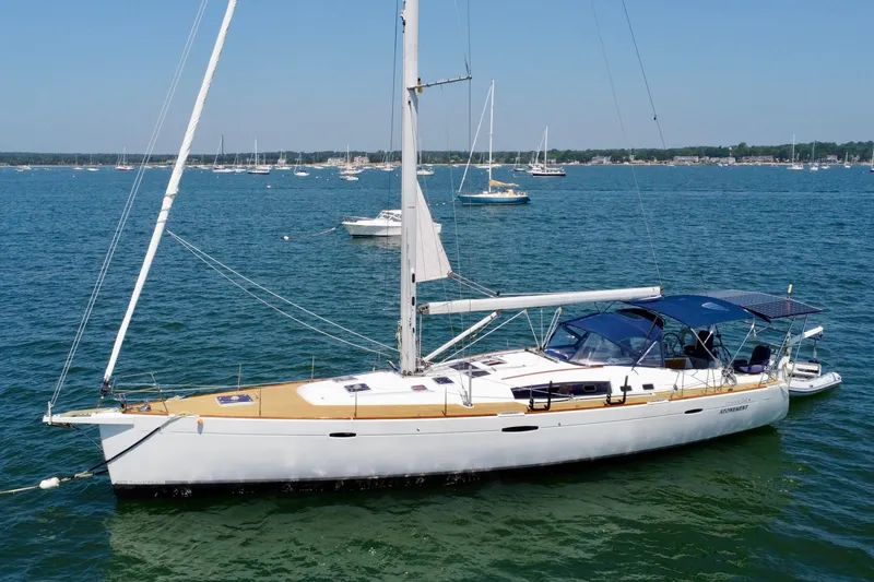 Slide: The Image of Sailing yacht Beneteau Oceanis 54, 2011 model, anchored in a serene bay. - 1